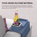Blue silicone sofa coaster with Heineken bottle, showcasing food-grade material and secure armrest fit for beverages and snacks.
