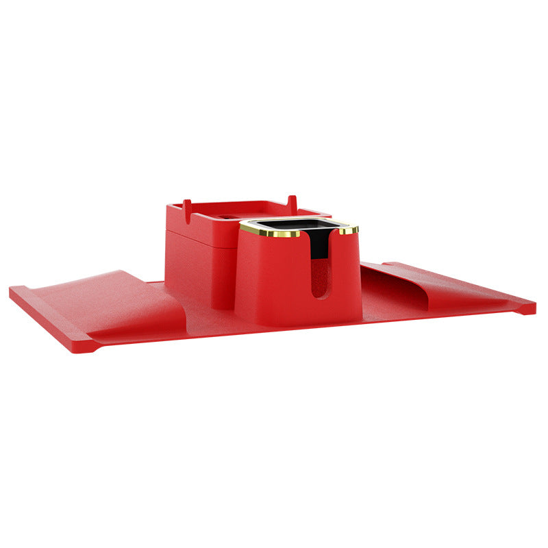 Red silicone sofa armrest cup holder with elevated tray and gold-accented drink slot, ideal for modern home beverage storage.