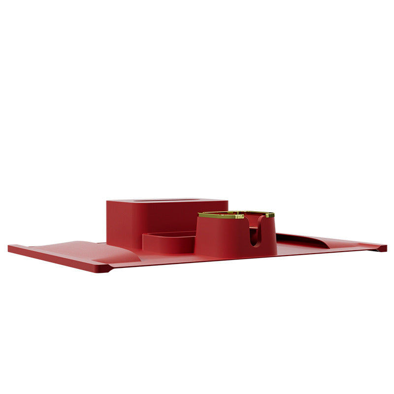 Side view of red silicone sofa armrest cup holder with flat tray and gold-accented cup slot, ideal for multifunctional home use.