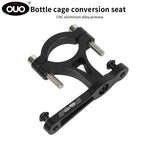 OUO Bicycle CNC Universal Water Bottle Holder Converter in black aluminum alloy with dual mounting bolts for secure attachment.