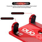 Red CNC mobile phone holder with silicone cushioning patches to protect phone surface from direct contact and damage during cycling.