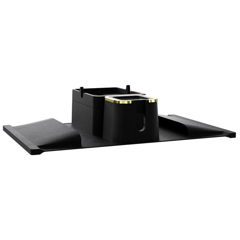 Angled view of black silicone sofa armrest cup holder with elevated tray and gold-trimmed cup slot for stylish drink organization.